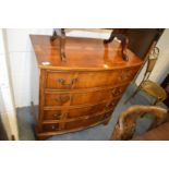 A good Georgian style yew wood bow front four drawer chest with inlaid decoration.