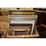 A quantity of picture frames.