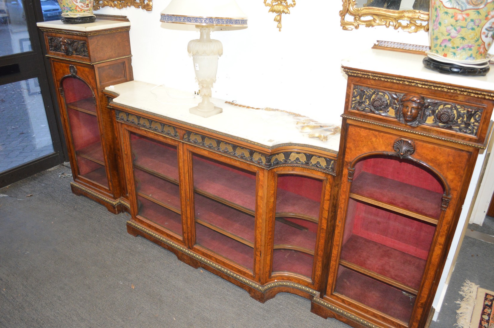 A good Victorian walnut, marble and ormolu mounted drop centre side cabinet, possibly by Gillow.