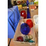 Colourful glass vases and other ornamental items.