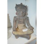 An unusual pottery seated figure.