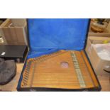 A cased zither.