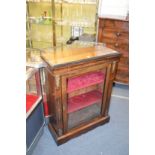 A Victorian inlaid walnut pier cabinet with ormolu mounts.