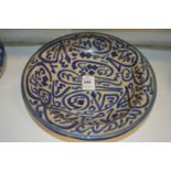An Islamic circular pottery bowl.