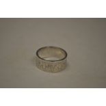 An unusual ring made from a 1954 two shilling coin, size V (made by Mick Griffiths).