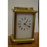 A brass carriage clock.