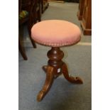 A Victorian mahogany revolving music seat.