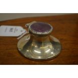 A small silver and enamel capstan inkwell.