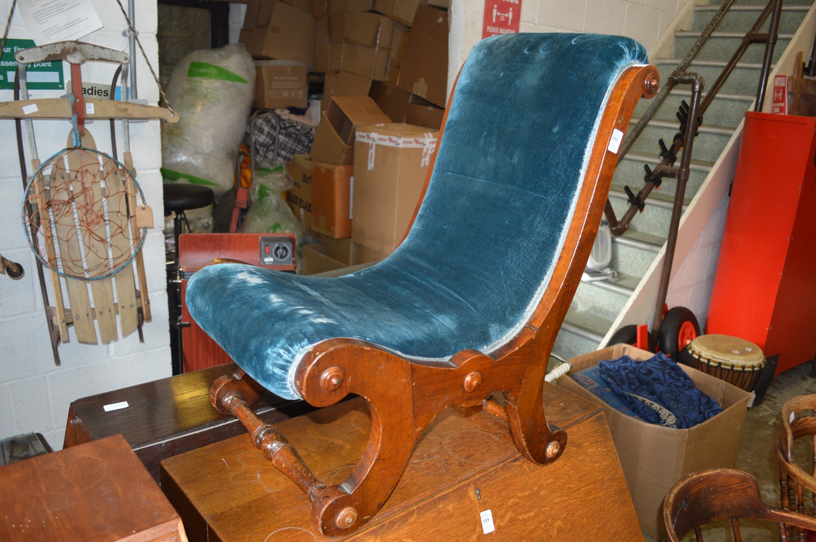 A small mahogany framed bedroom chair.