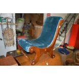 A small mahogany framed bedroom chair.