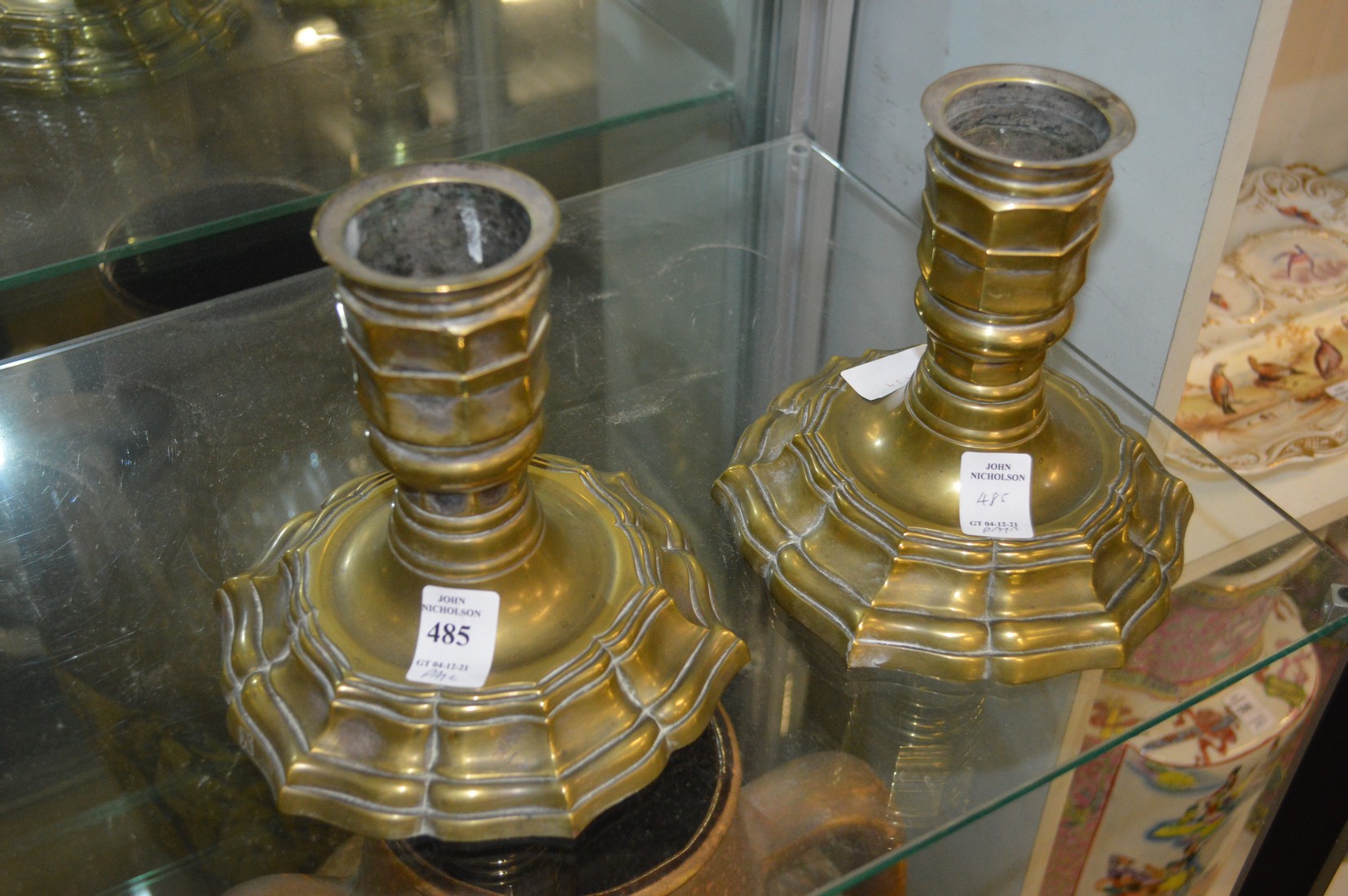 A pair of cast metal candle stands or hookah bases, possibly Paktong.