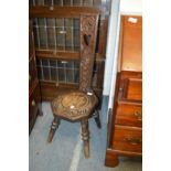 A carved walnut spinning chair and another chair.