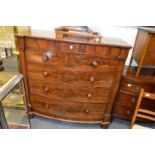 A large Victorian mahogany bow front chest of drawers.