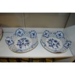 A pair of Meissen blue and white floral decorated baskets with pierced sides.