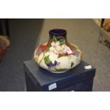 A Moocroft large squat shaped floral decorated vase with original box.