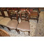 A pair of Victorian mahogany balloon back dining chairs.