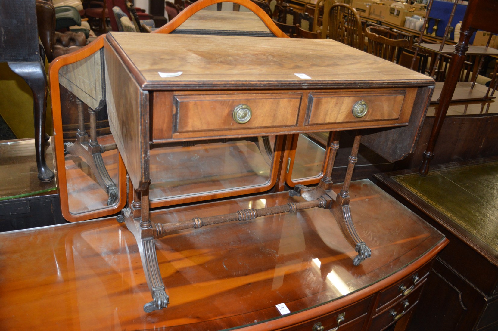 A miniature mahogany sofa table.