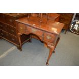 A George III mahogany lowboy.