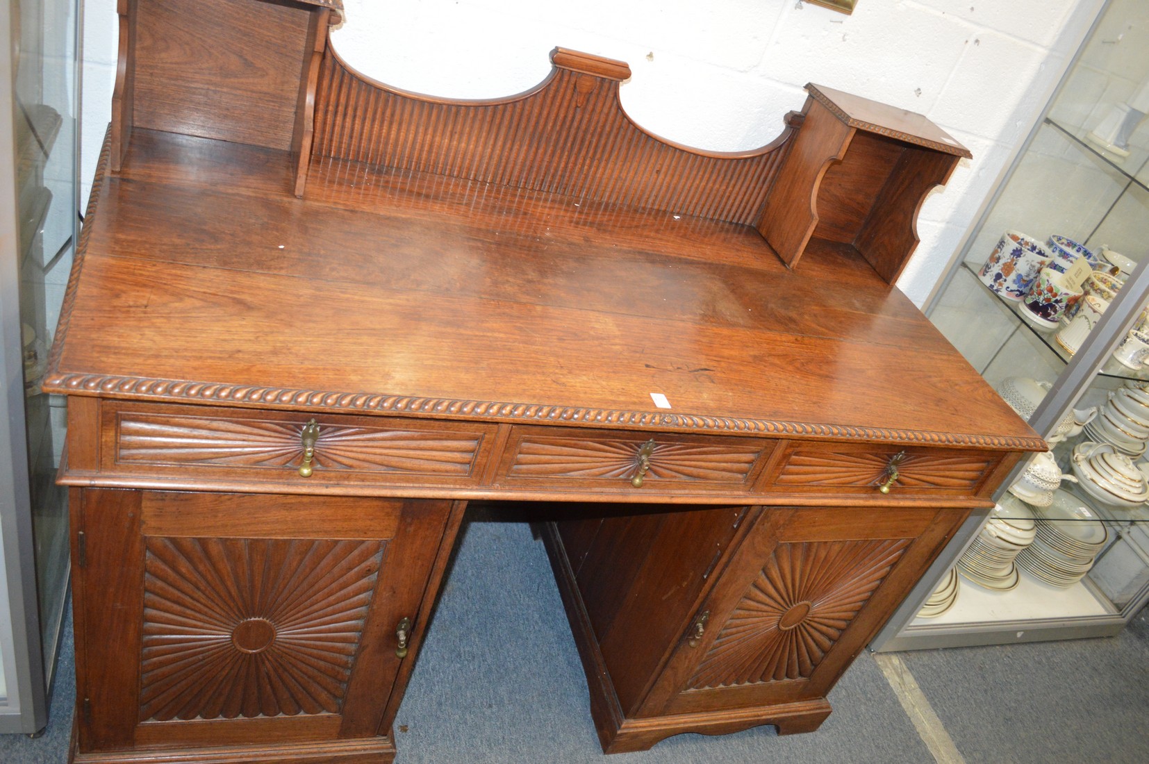 A early 20th century rosewood pedestal sideboard.