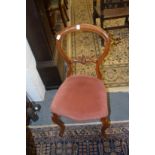 A set of four Victorian mahogany balloon back dining chairs.