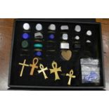 A case containing numerous aluminium and wax signet ring blanks and other patterned jewellery