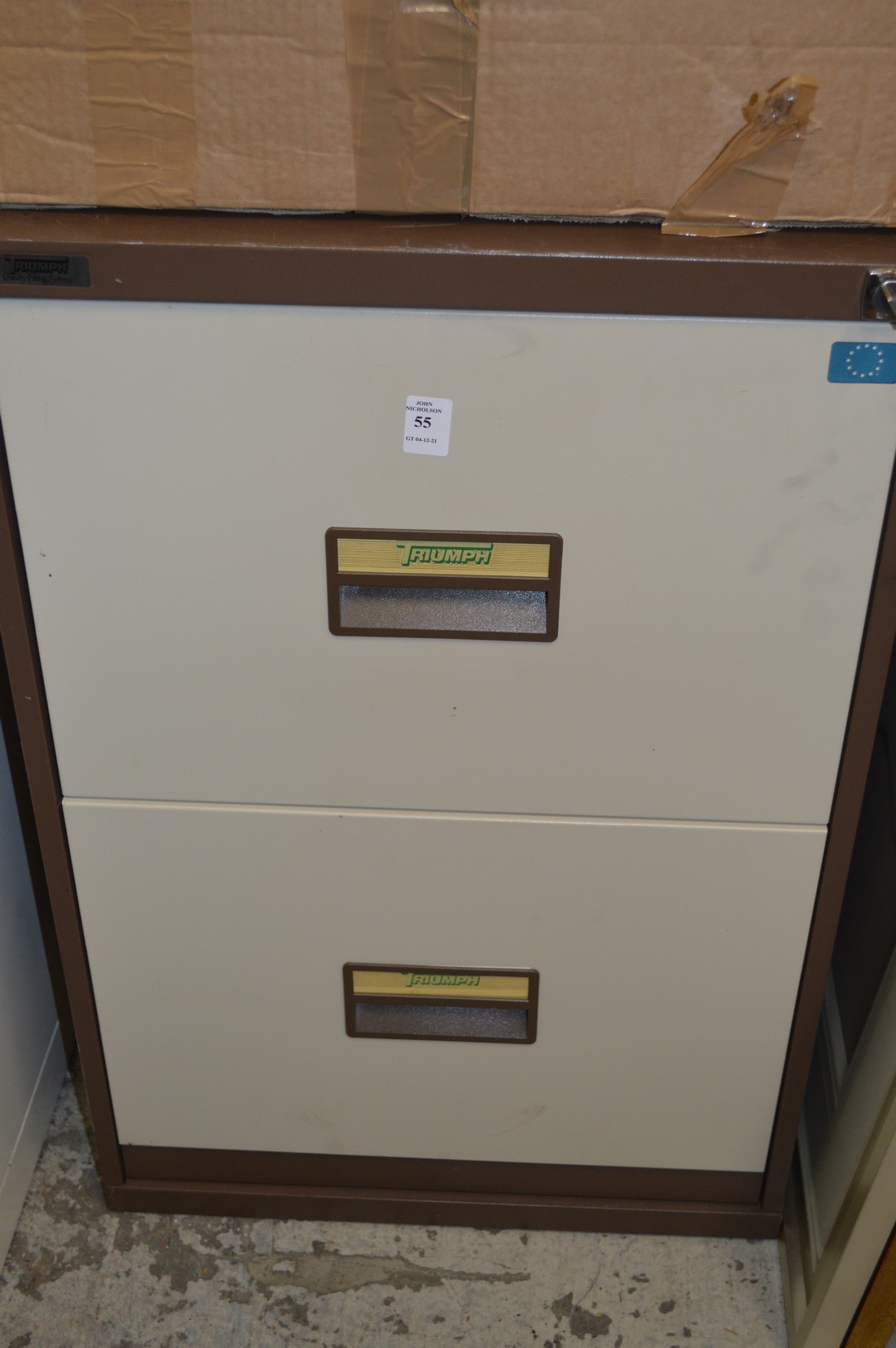 A two drawer metal filing cabinet.