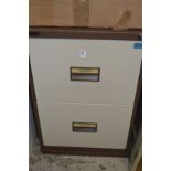A two drawer metal filing cabinet.