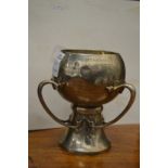 An Art Nouveau silver three handled pedestal trophy cup.