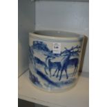 A large Chinese blue and white brush pot painted with deer in a landscape.