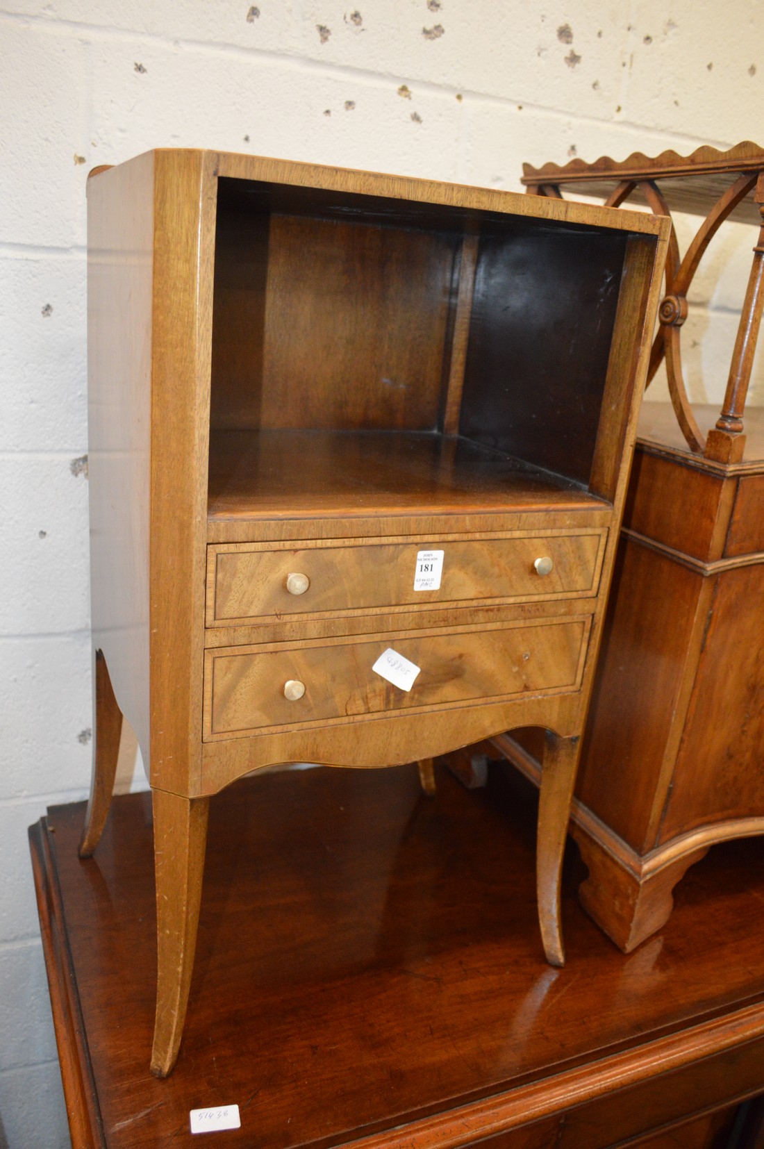 A pair of mahogany two drawer bedside tables.