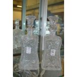 A pair of cut glass decanters.