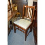 A set of four 19th century oak single dining chairs with drop-in seats.