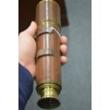 A leather covered brass telescope.