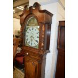 A 19th century oak cased eight day long case clock with painted arch dial, signed Smith, Walton.