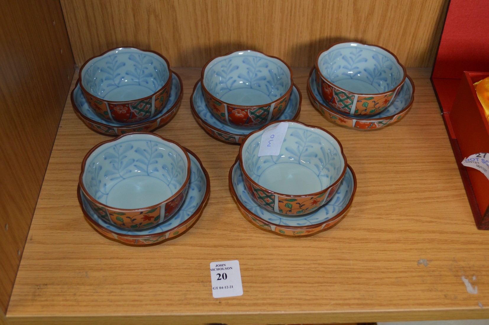 A set of five Chinese bowls with matching stands.