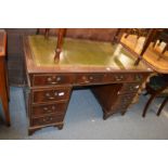 A reproduction mahogany pedestal desk.