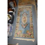 A small blue ground rug.