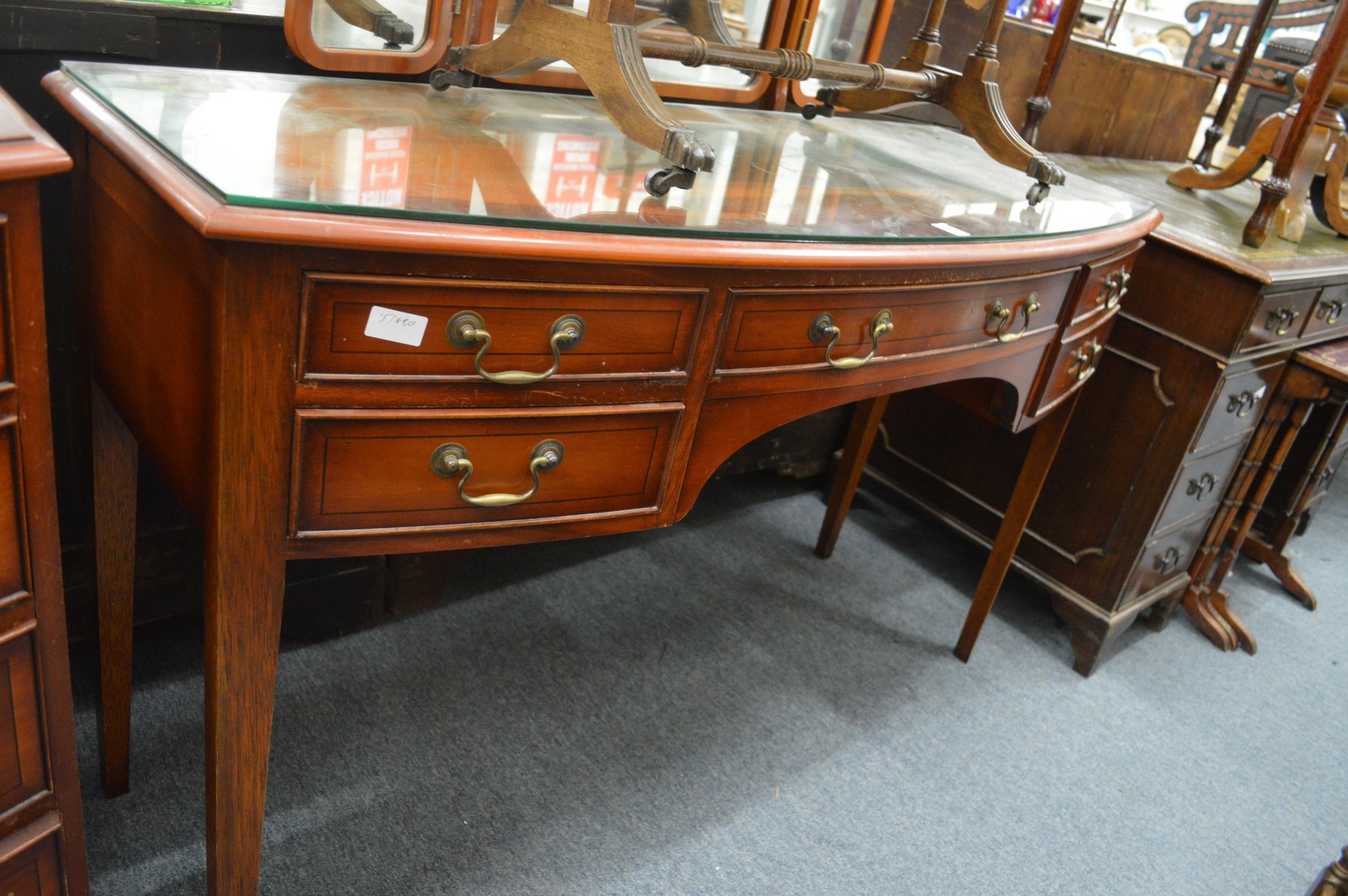 A yew wood bow fronted dressing table.