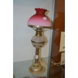 An oil lamp with plated base (converted to electricity).