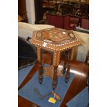 An eastern inlaid hexagonal shaped table.