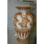 A Royal Doulton silicon ware vase with applied decoration.