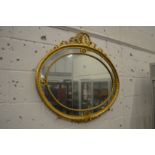 A good decorative oval gilt framed wall mirror.