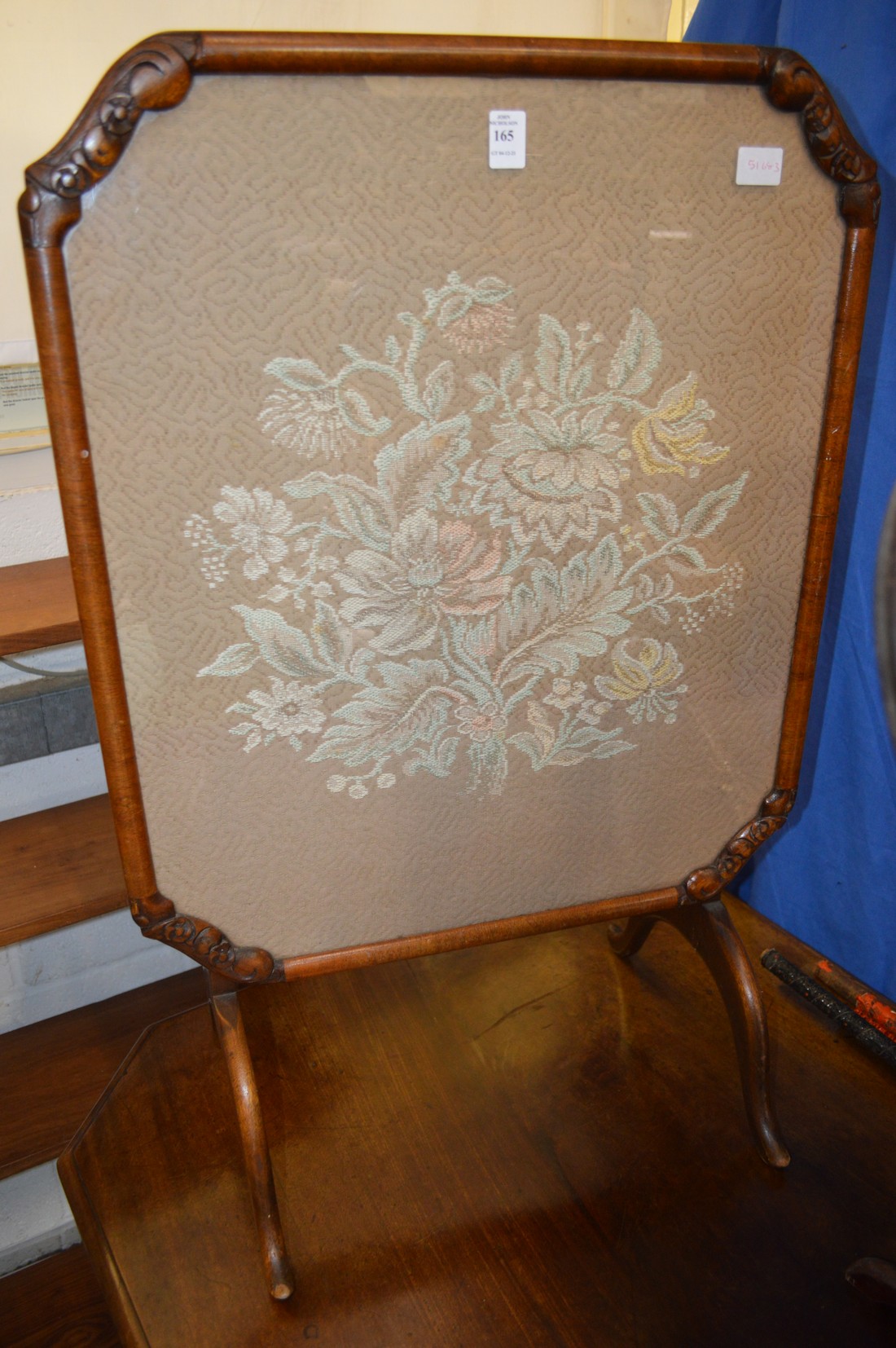 A fire screen / folding table.