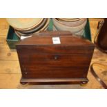 A Victorian mahogany tea caddy.