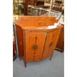 A good Sheraton revival painted satinwood serpentine fronted two door side cabinet.