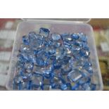 A quantity of sapphire coloured stones.