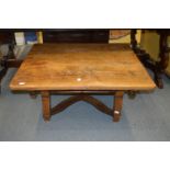 A French fruitwood low table with sliding top to reveal a storage base.