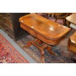 A 19th century mahogany D-shaped foldover card table on a square column support platform base with