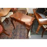 A George III mahogany foldover card table on cabriole legs.