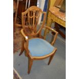 A pretty inlaid mahogany shield back armchair.